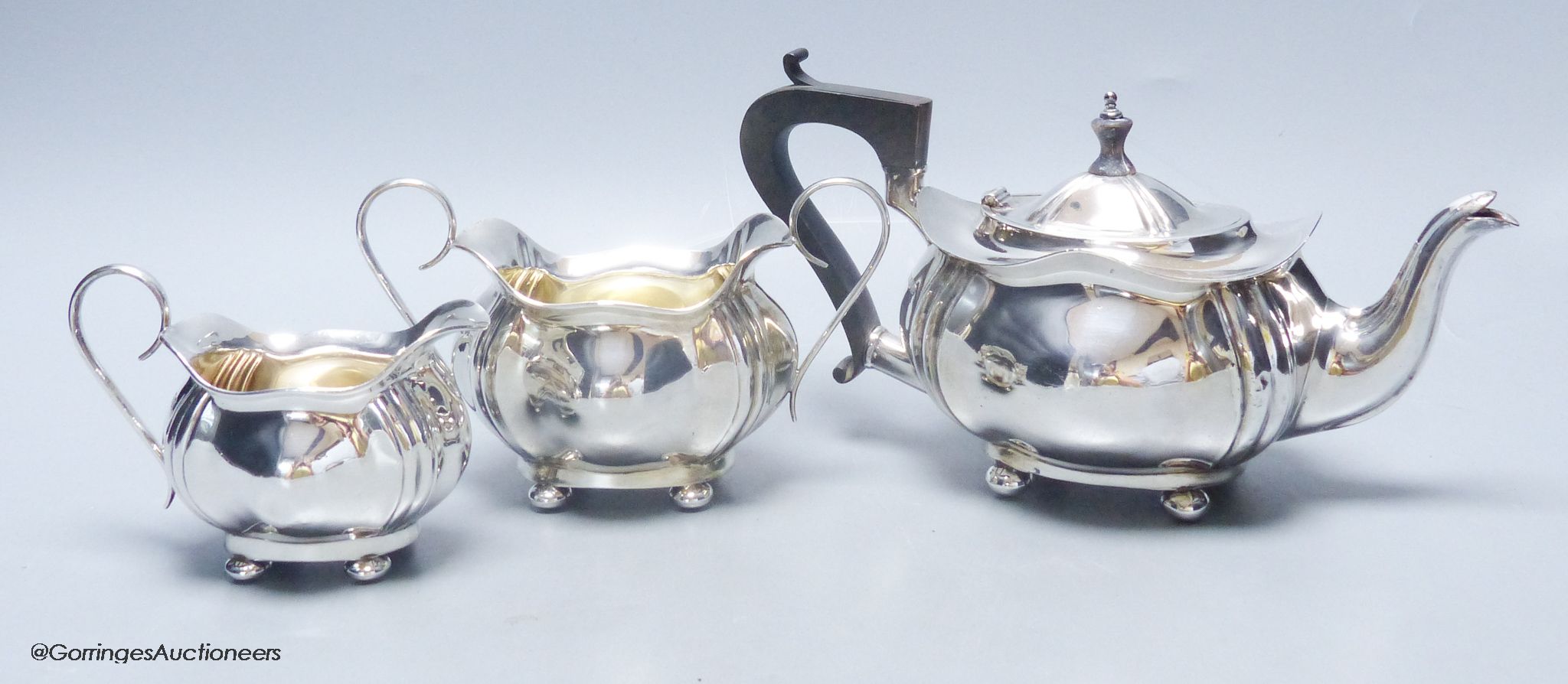 A Scottish silver three-piece tea service, of ribbed, bellied oval form, gross 18.5oz approximately